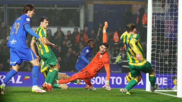 West Brom's Charlie Taylor clears off the line