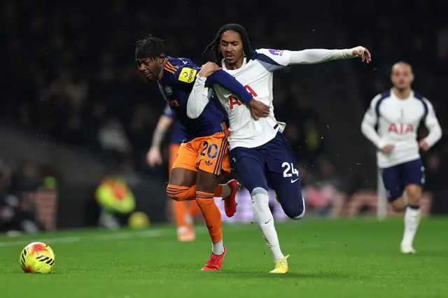 Anthony Elanga of Newcastle United is challenged by Djed Spence of Tottenham Hotspur during the Premier League match between Tottenham Hotspur and Newcastle United at Tottenham Hotspur Stadium on February 10, 2026 in London, England.