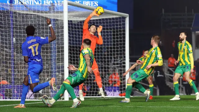 West Brom goalkeeper Max O'Leary makes a save