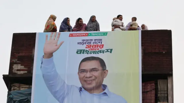 People watch the BNP rally from their rooftops