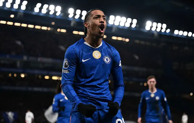 Joao Pedro celebrates.