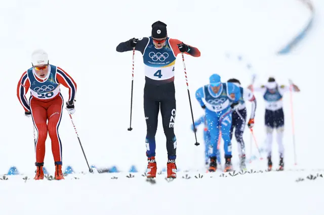 Czech Republic's Jiri Tuz (C) crosses the finish line ahead of Norway's Oskar Opstad Vike