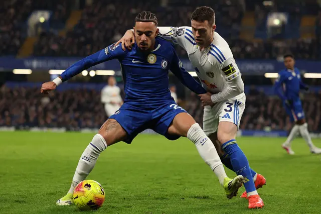 Chelsea's French defender #27 Malo Gusto (L) vies with Leeds United's Swedish defender #03 Gabriel Gudmundsson (R) during the English Premier League football match between Chelsea and Leeds United at Stamford Bridge in London on February 10, 2026.