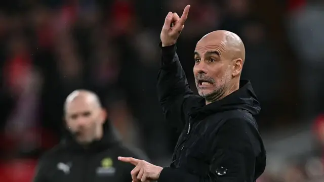 Pep Guardiola pointing