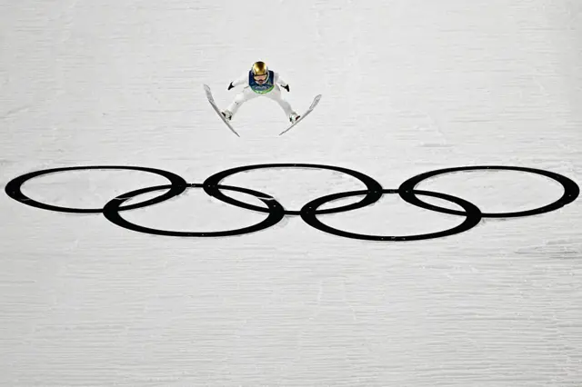 Slovenia's Anze Lanisek jumps during the ski jumping mixed team 1st round of the Milano Cortina 2026 Winter Olympic Games at Predazzo Ski Jumping Stadium in Predazzo