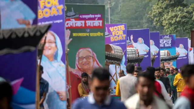A line of Sheikh Hasina banners on a street