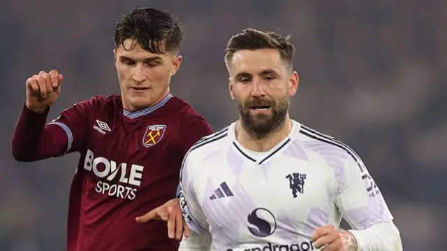 Freddie Potts of West Ham United and Luke Shaw of Manchester United during the Premier League match between West Ham United and Manchester United at London Stadium on February 10, 2026 in London, United Kingdom.