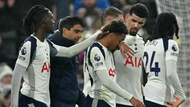 Wilson Odobert reacts as he leaves the pitch injured