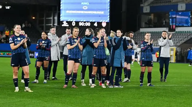 Arsenal players clap the fans at the end