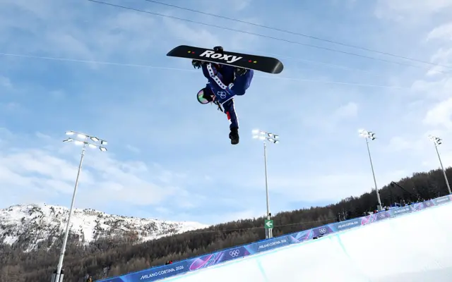 A snowboarder doing a half-pipe during the Winter Olympics