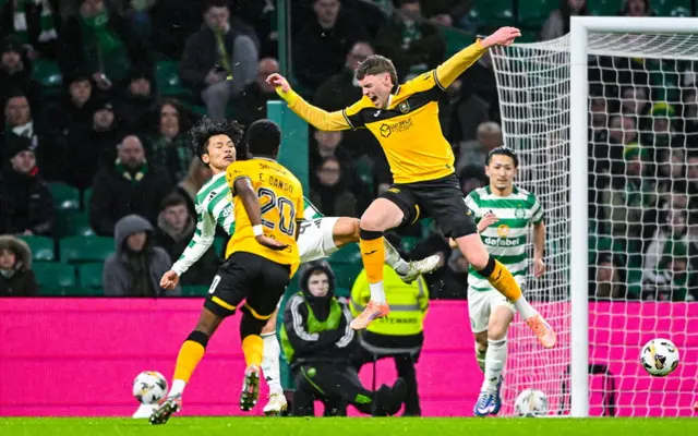 Reo Hatate fouls Robbie Muirhead