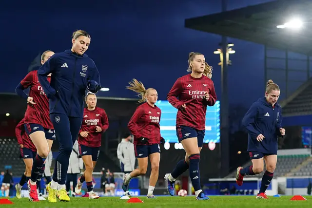 Arsenal players warm up