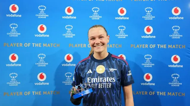 Maanum poses with the POTM trophy
