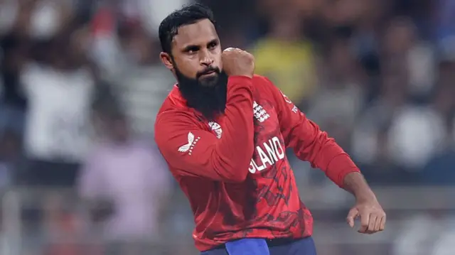 Adil Rashid of England celebrates after Rovman Powell of West Indies (not pictured) is caught out by Jamie Overton