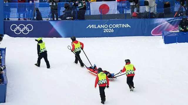 Liu getting taken away on a stretcher