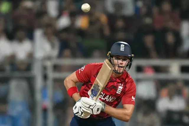 England's Jacob Bethell watches the ball after playing a shot