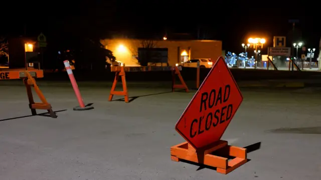 irst one has this caption: The road is blocked off before the Tumbler Ridge Secondary School in Tumbler Ridge, B.C. on Wednesday, Feb. 11, 2026.