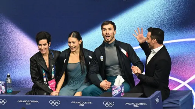 France's Laurence Fournier Beaudry and Guillaume Cizeron react