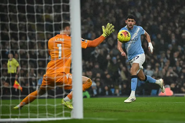 Matheus Nunes wtches as Bernd Leno saves his shot