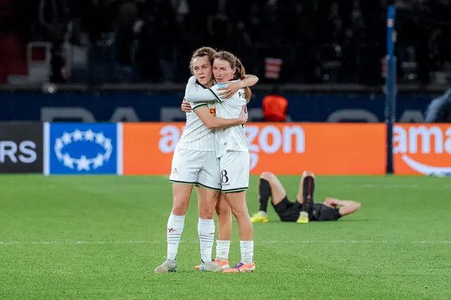 Leuven players celebrate at FT after their result in Paris