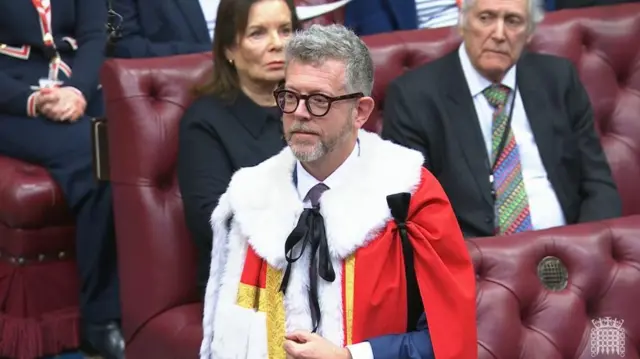 Lord Matthew Doyle in the House of Lords wearing ceremonial robes