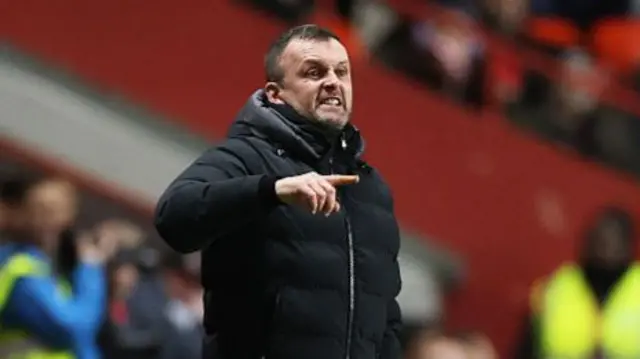 Nathan Jones grimacing on the Charlton sideline