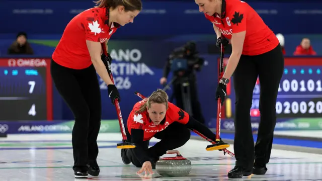 Canada's curlers aim a stone