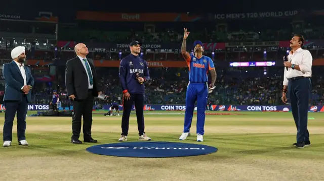 Gerhard Erasmus of Namibia and Suryakumar Yadav of India perform the coin toss