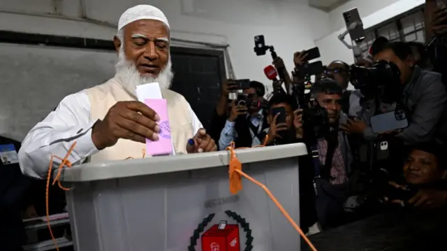 Shafiqur Rahman, Jamaat-e-Islami Ameer (President), votes inside a polling station during the national election in Dhaka