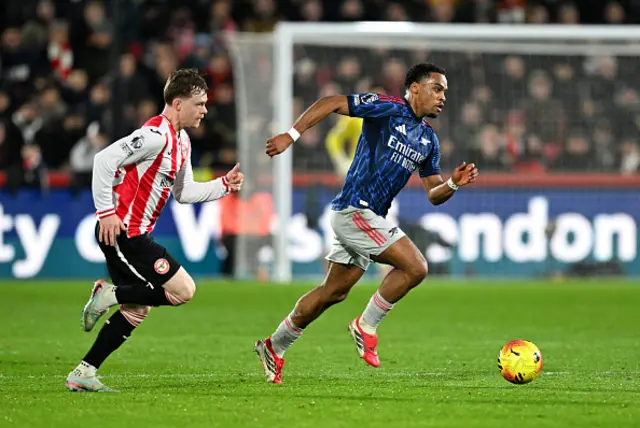 Jurrien Timber of Arsenal on the ball whilst under pressure from Keane Lewis-Potter