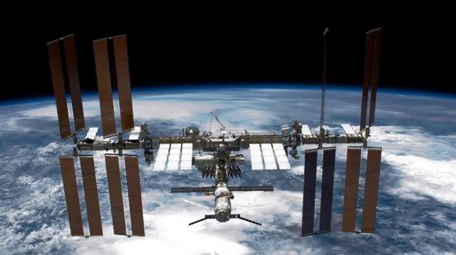 An image of the space station floating above the earth
