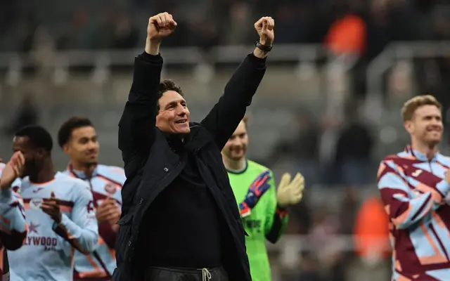 Keith Andrews with his hands in the air