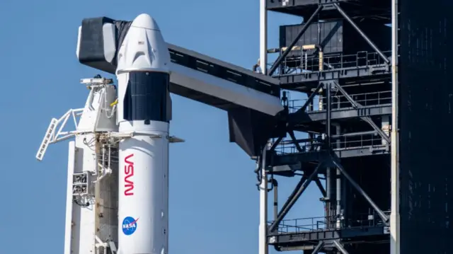 The SpaceX Falcon 9 rocket and Dragon spacecraft are seen ahead of a launch at Launch Complex 39A at the NASA’s Kennedy Space Center on March 14, 2025