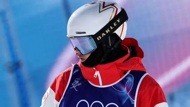 Mikael Kingsbury inspects the course