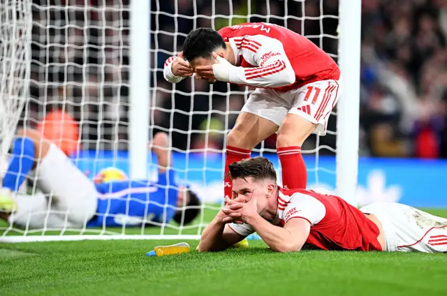 Viktor Gyokeres on the floor with his hands over his face