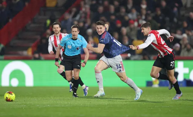 Arsenal's Viktor Gyokeres is pulled back by Brentford's Vitaly Janelt