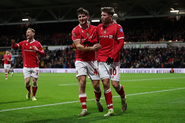 Josh Windass of Wrexham celebrates after scoring his teams first goal during the Emirates FA Cup Fourth Round match between Wrexham and Ipswich Town