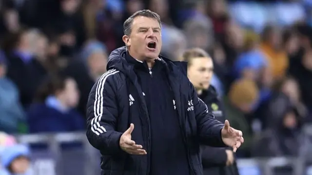 Rick Passmoor reacts on the touchline