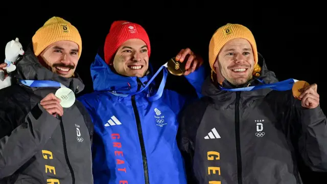 Matt Weston (centre) on the podium