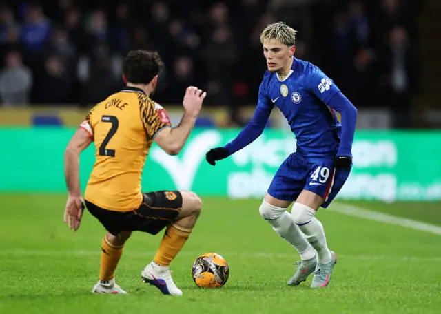 Alejandro Garnacho of Chelsea on the ball whilst under pressure from Lewis Coyle