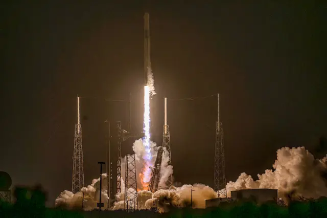 The SpaceX Falcon 9 rocket and Dragon spacecraft lifts off