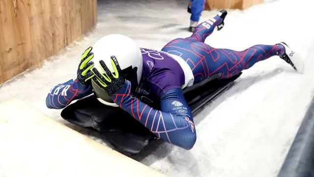 Matt Weston holds his head in disbelief after finishing his fourth run
