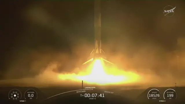 The rocket lands back on earth in a burst of fire