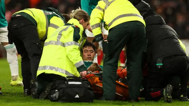 Wataru Endo is treated on the pitch at Sunderland