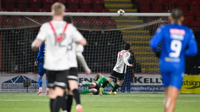 St Johnstone goalkeeper Toby Steward makes a save to deny Airdrieonians' Chris Mochrie