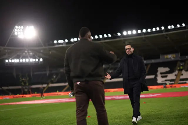 Liam Rosenior, Manager of Chelsea, interacts with former Hull City player Aaron McLean