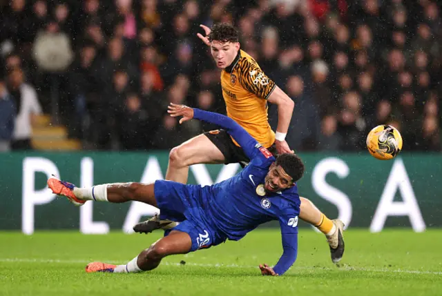 Wesley Fofana of Chelsea is fouled by Lewis Koumas