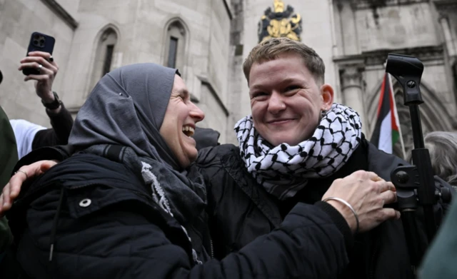 People react outside the High Court