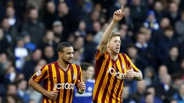 Bradford City's English striker Jon Stead (R) celebrates scoring his team's first goal