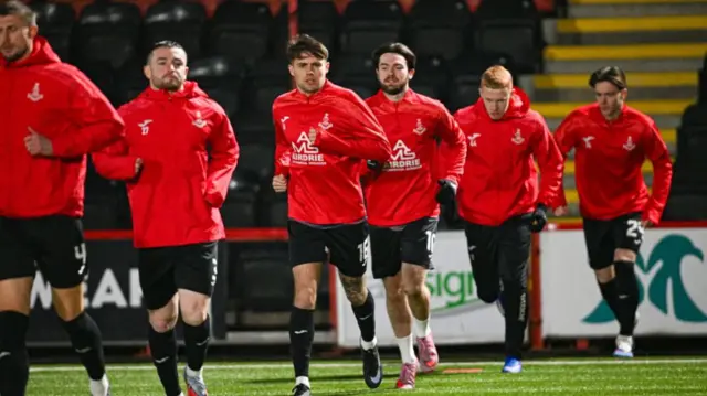 Airdrieonians players do their warm-up